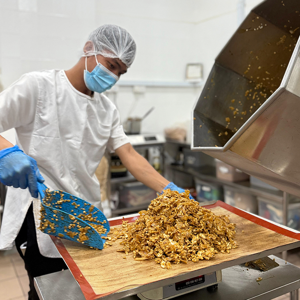 Food production team preparing snack mixes